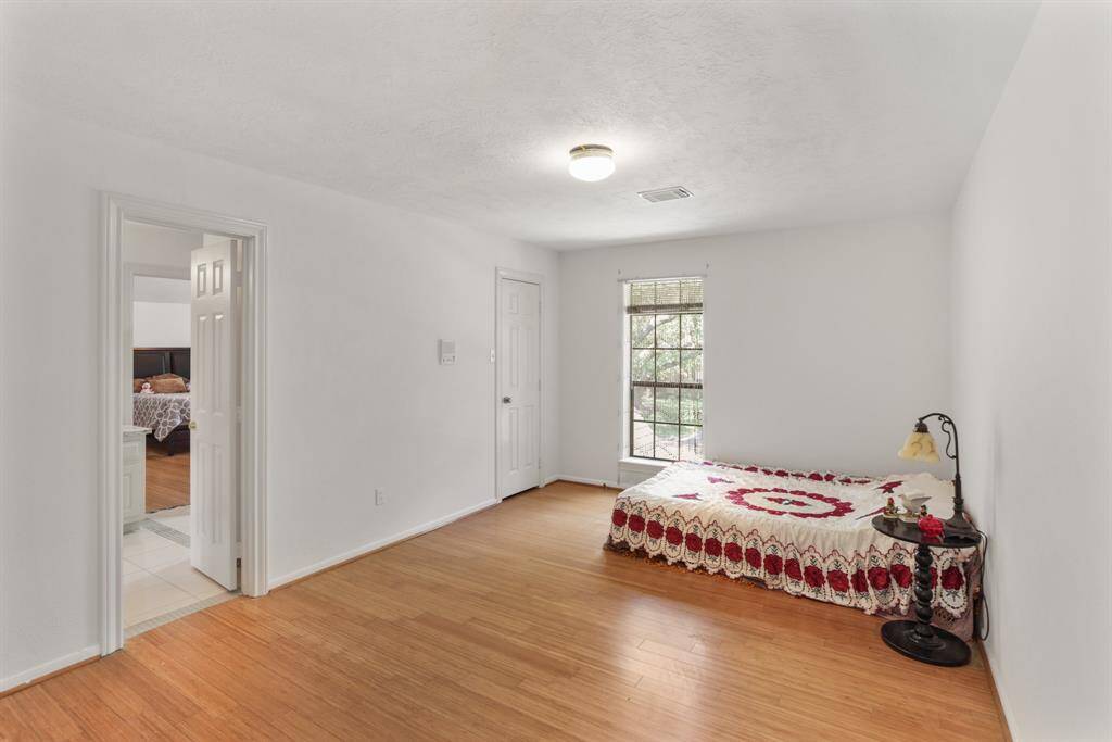Upstairs is this large Game Room or Sports area for all the family, custom rope lightning, Bamboo floors and plenty of natural light featuring the second wet bar in this home offering a great entertainment area for the young and old.