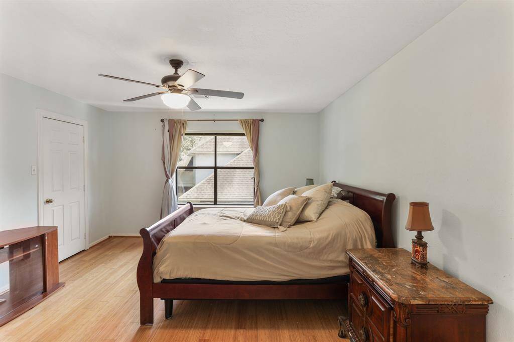4th bedroom upstairs with bamboo floors and plenty of room for all the furniture plus a large walk-in closet.