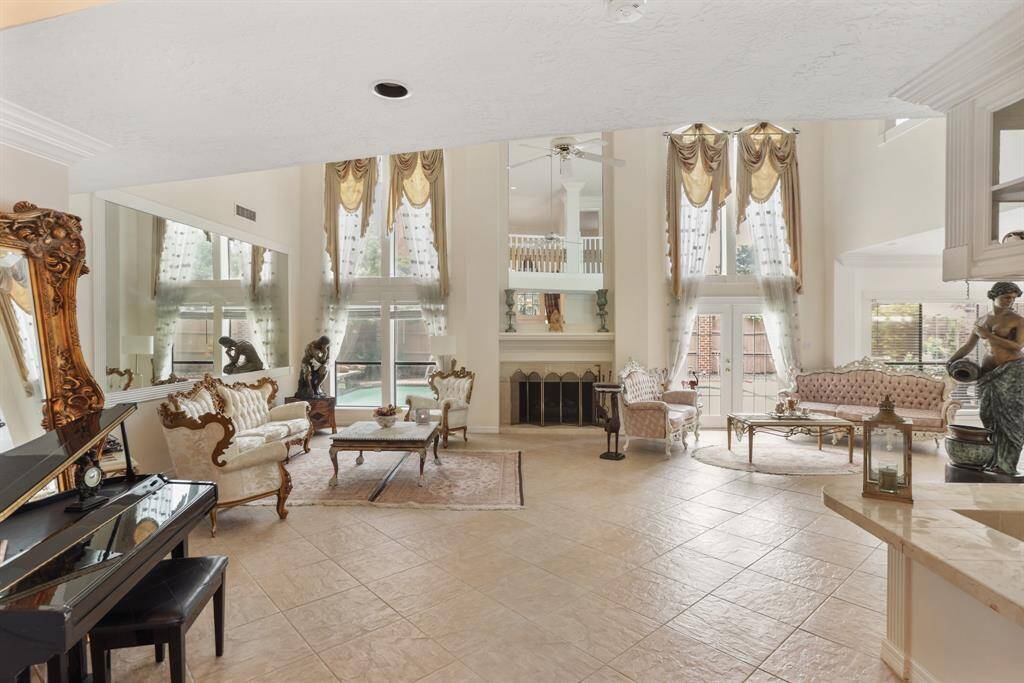 Upon entering this Grand home through a lead glass, wood door, you immediately see the beauty of this well maintained home. Custom Chandelier from Europe tells you are are going to be amazed at the elegance of this home.