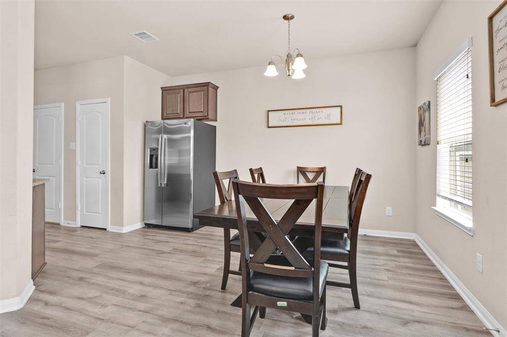 The Breakfast Room is located right off the Kitchen, perfect for enjoying everyday meals.