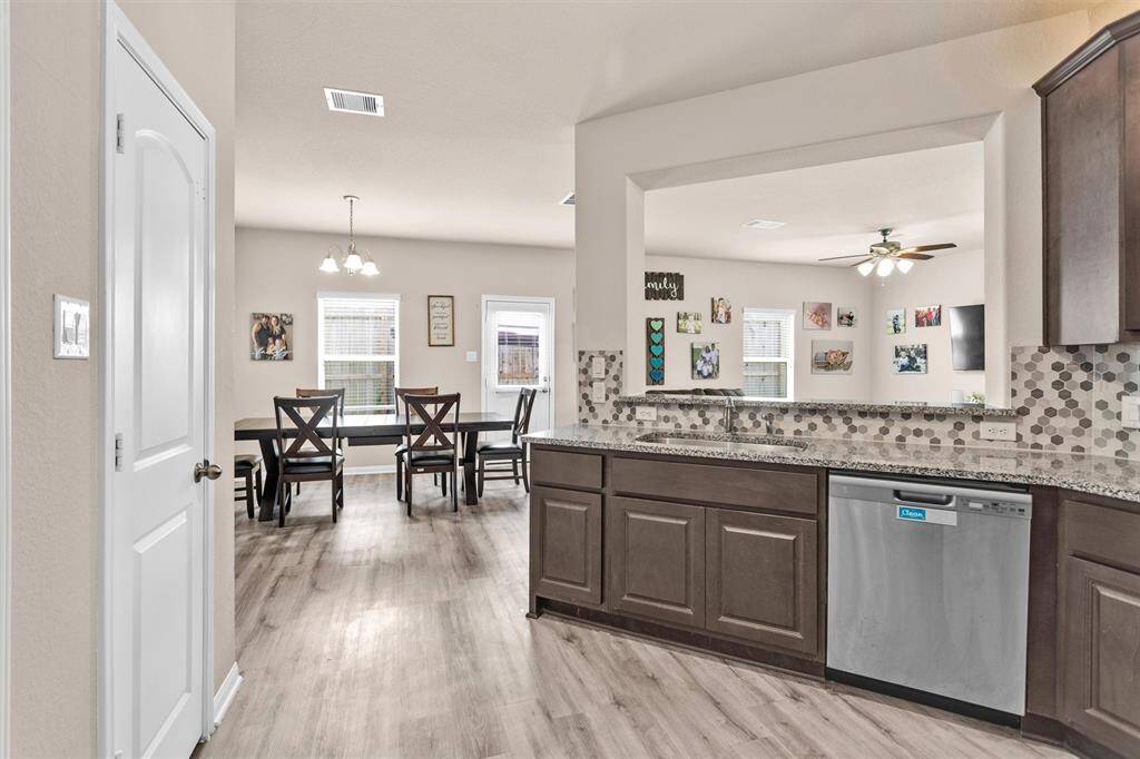 The modern Kitchen is a dream for any home chef featuring 42" upper cabinets and a large serving bar overlooking the oversized family room.