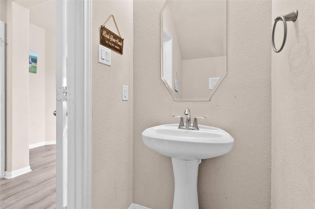 A Half-Bath downstairs provides convenience for guests.