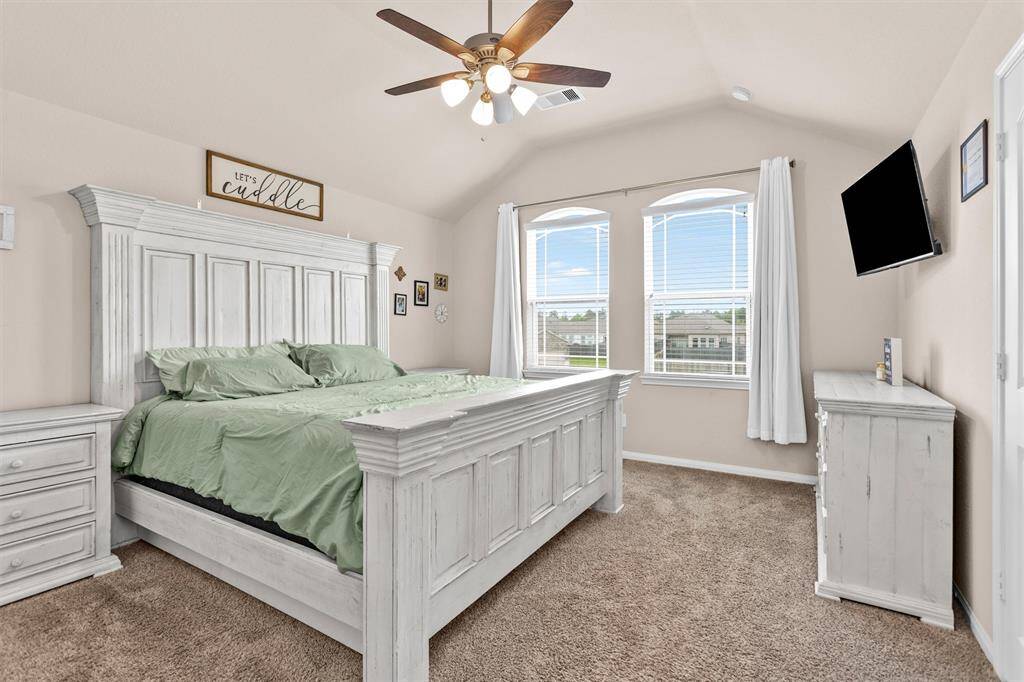 Take a look at your Primary Suite! Featuring carpet, a ceiling fan, Full Ensuite-Bath and large windows to fill the room with natural light!