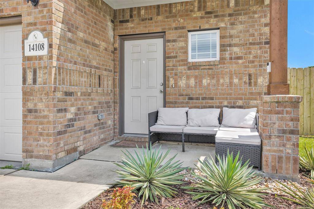 Welcome guests comfortably under the charming Front Porch!