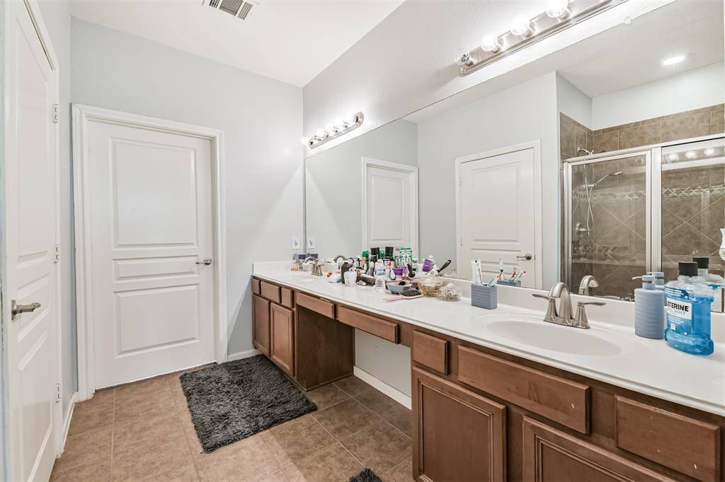 Vanity area in primary bathroom has ample room