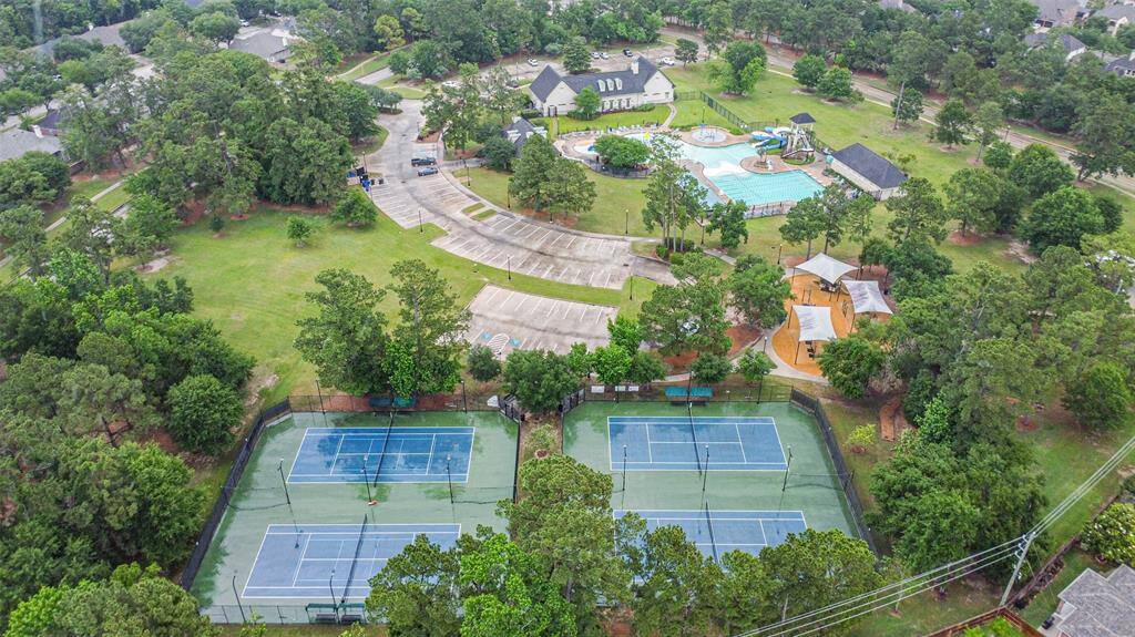 Community area with tennis courts, pools, playground, and more