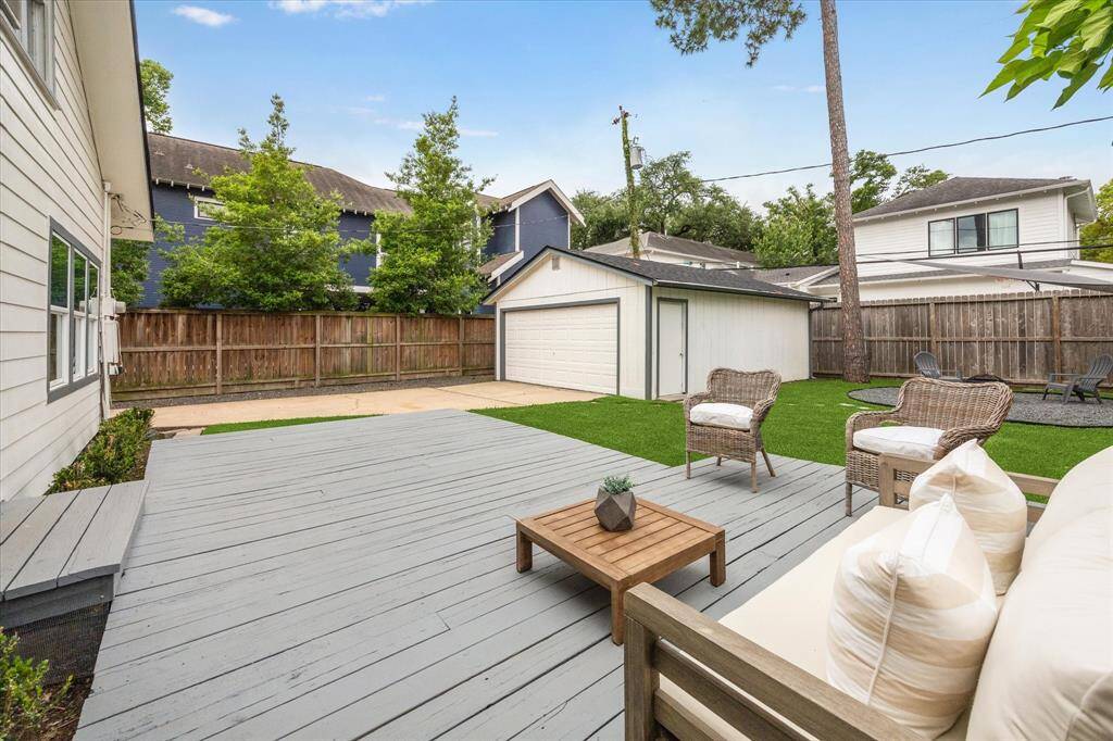 Spacious back deck designed to seamlessly extend the living space outdoors, perfect for entertaining or relaxing.