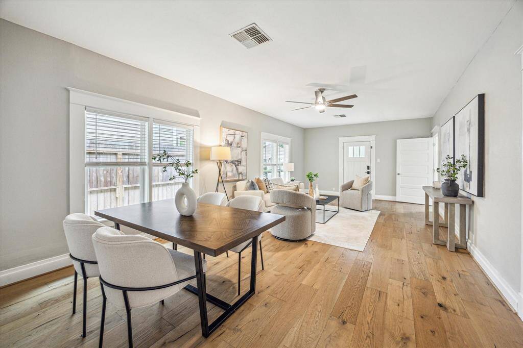 The living and dining rooms flow together, creating an ideal space for both everyday living and entertaining.