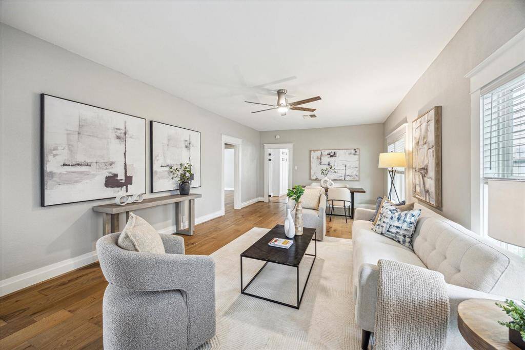 Step inside to find wide-plank engineered wood floors and a spacious living room and dining area.
