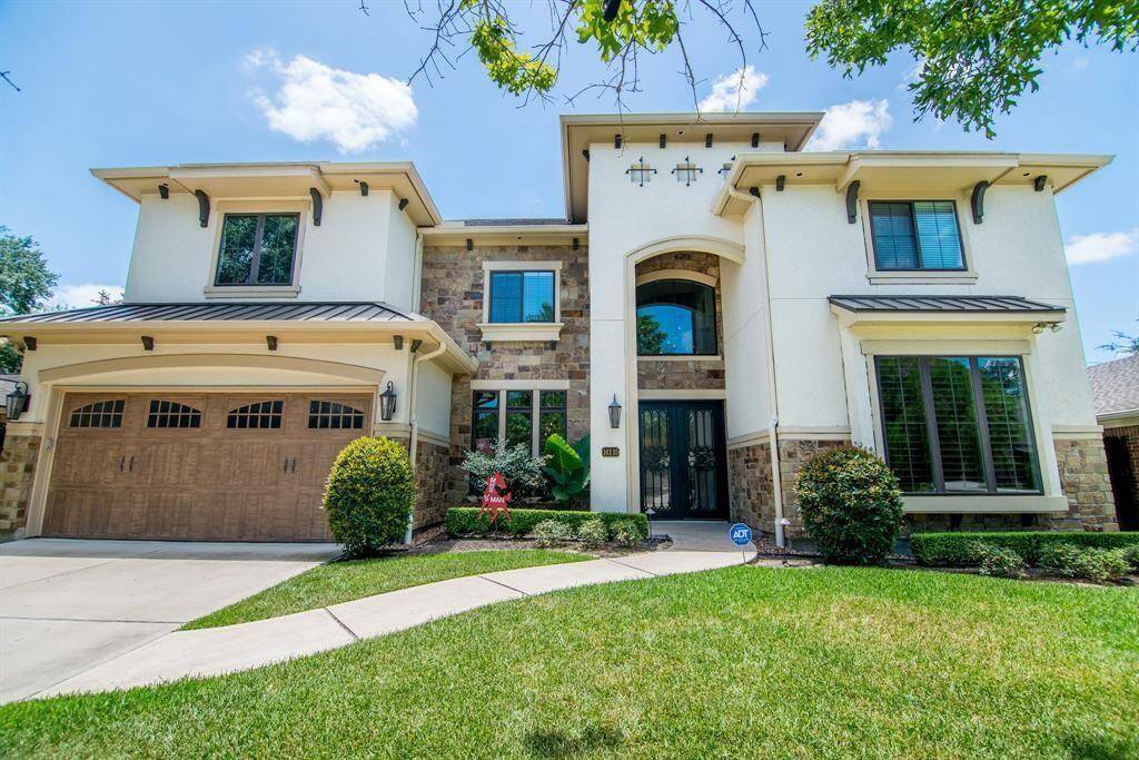 Stunning Mediterranean custom home with remarkable curb appeal.