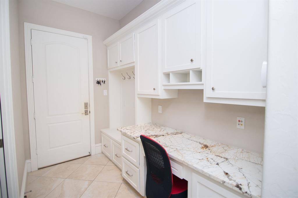 Stylish mudroom with built-in desk, perfect for organization and convenience.