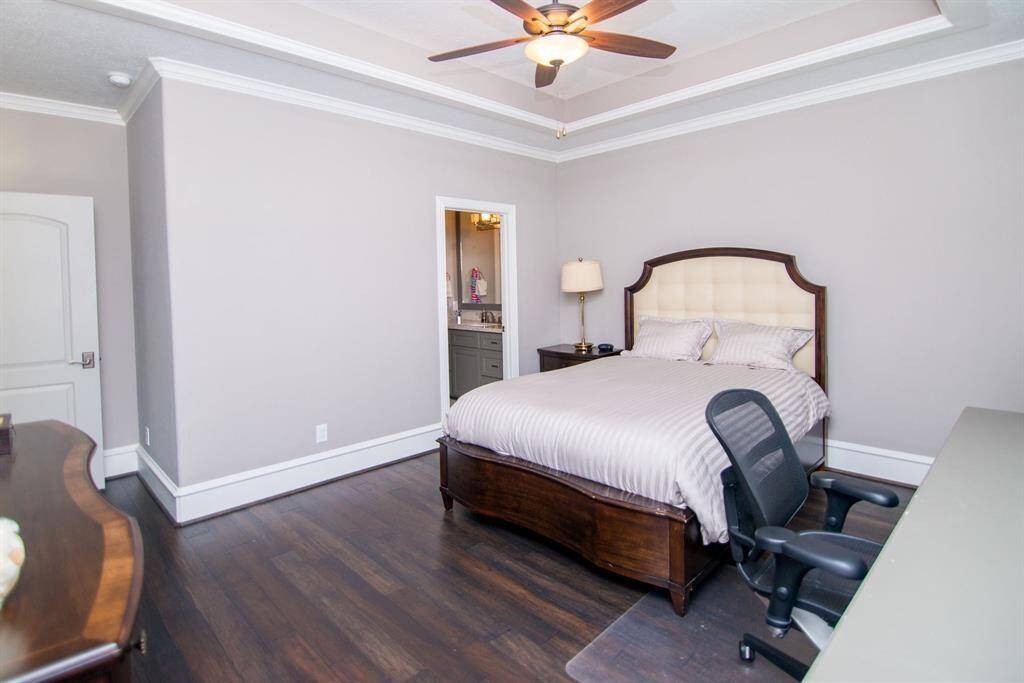 Spacious en suite bedroom with a built-in desk for convenience and comfort.