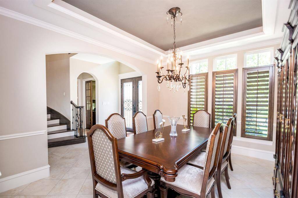 Elegant dining room with natural light, perfect for hosting memorable gatherings.
