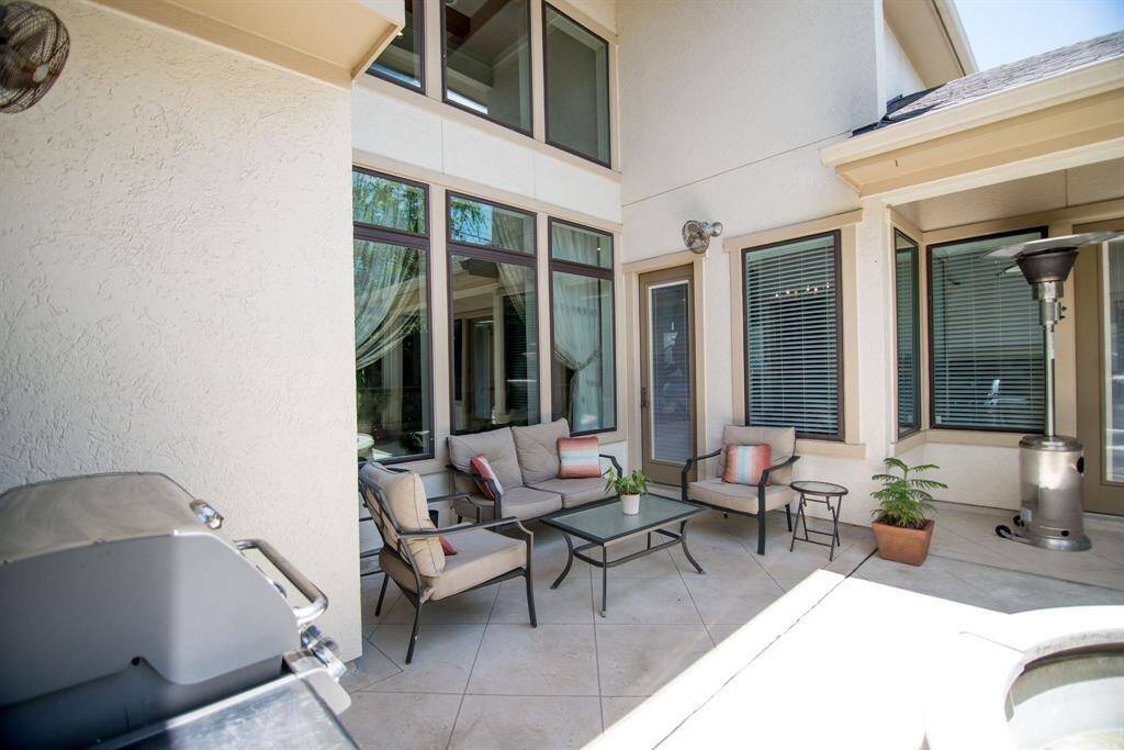 Chic patio with stylish barbecue furniture, perfect for outdoor entertaining.