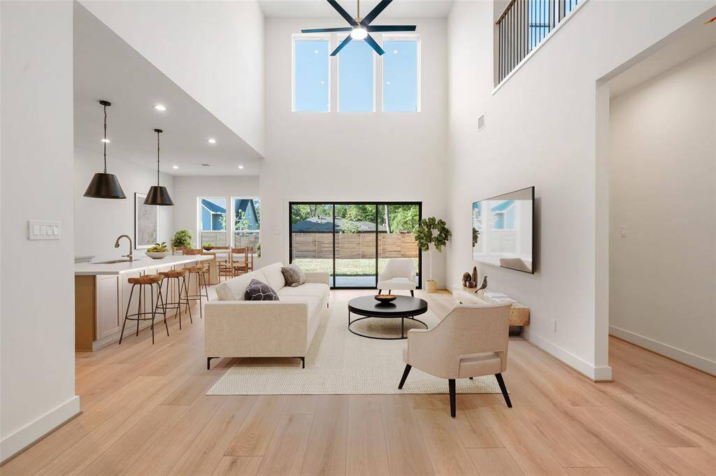 Stunning New Construction Home by Bengala Homes featuring High Ceilings, natural light, designer-style kitchen and high-end finishes. Virtually staged.