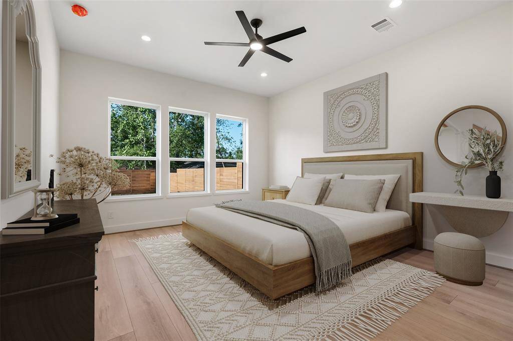 Bright primary bedroom with spectacular ensuite bathroom. Virtually staged.