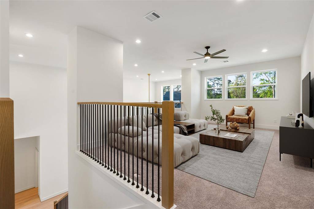 Upstairs, you'll find a versatile family room, two additional bedrooms and bathroom, and closet space for storage. Virtually staged.