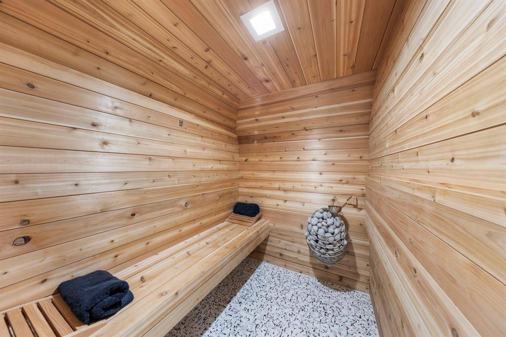 Unwind in the dry sauna located within the spacious primary bedroom—designed for ultimate relaxation.