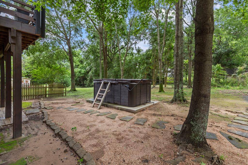 Unwind in the hot tub nestled among the trees for a peaceful, private escape.