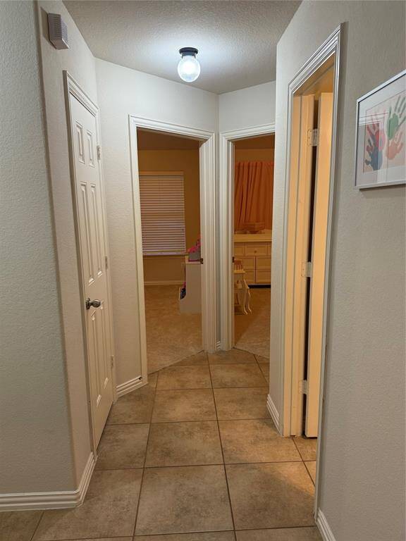 Hallway to secondary bedrooms