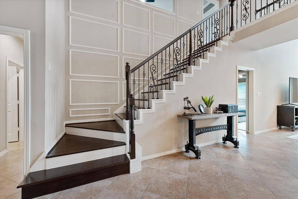 Wood treads on the staircase to the gameroom and beds upstairs