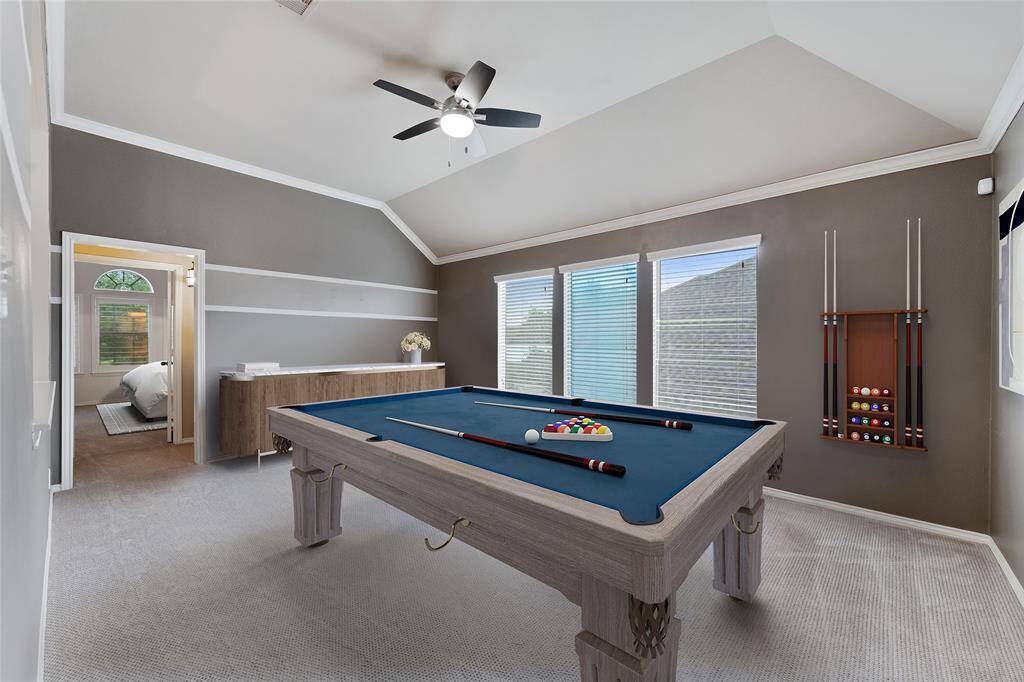 Gameroom with custom paint and high ceiling. Virtually Staged.