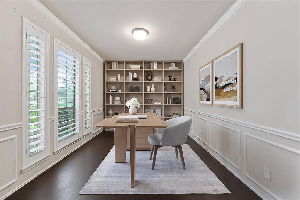 Home office with custom moldings and planation shutters.  Virtually staged