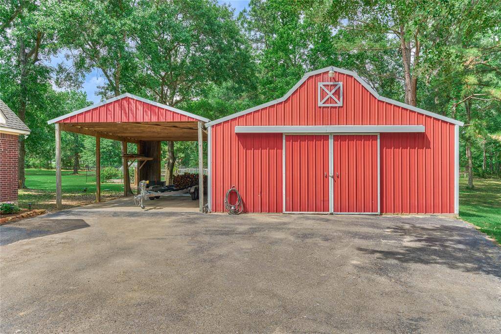 30x30 barn with shelving and covered RV parking wih 50A service