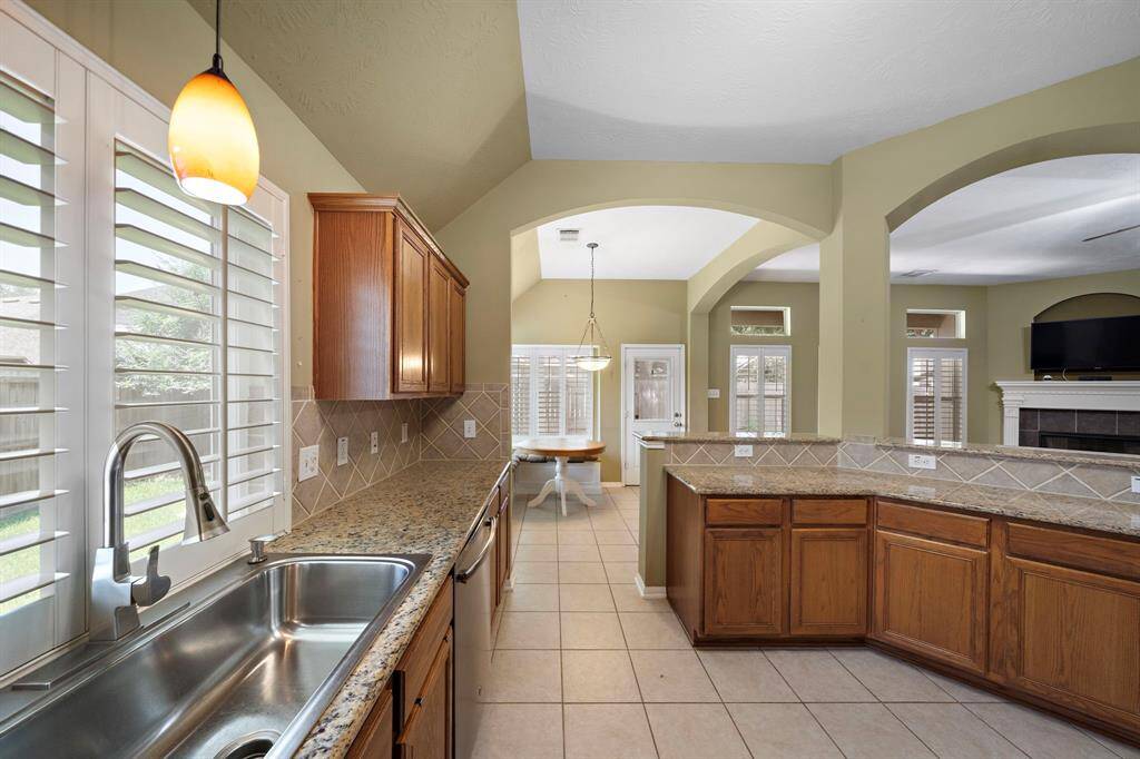 Updated, oversized single basin sink with large window that allows natural light to fill the kitchen.