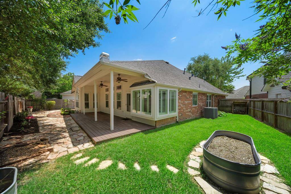 Room in the backyard for a raised bed garden and grass for your four legged family members.