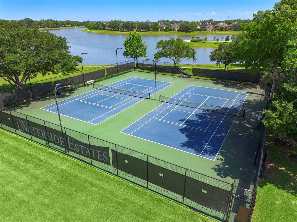 Community tennis courts overlooking the lake.
