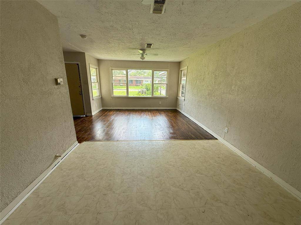 View of breakfast area and living area from the kitchen entry.