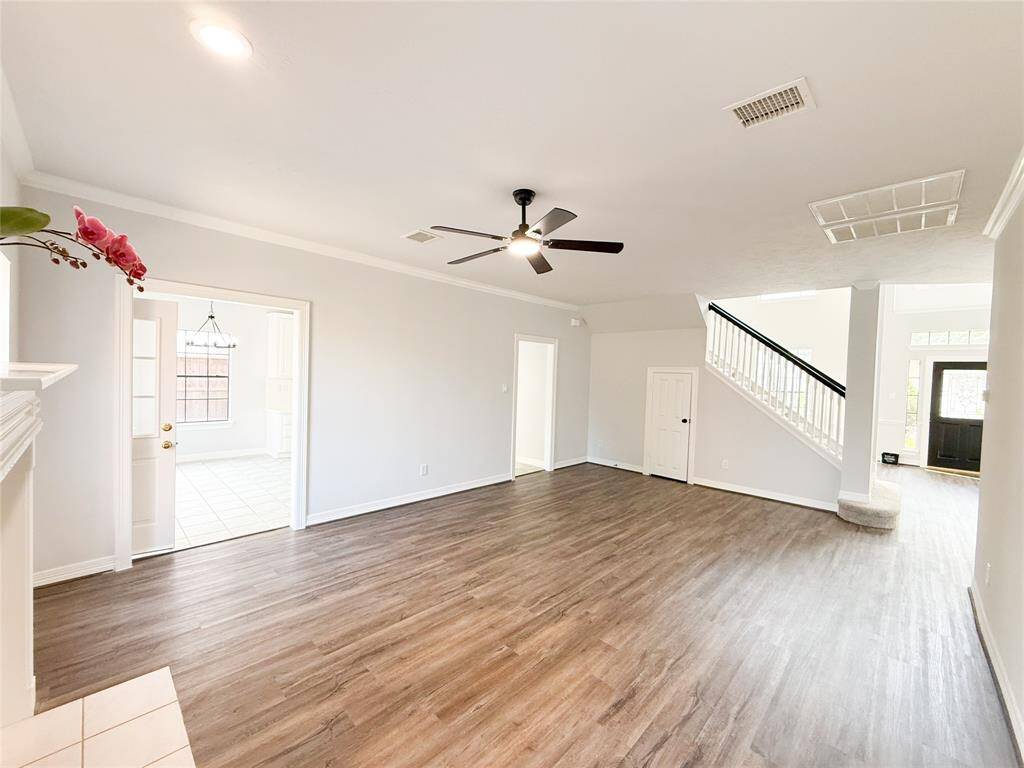 Opened floor plan between kitchen backdoor and living room.