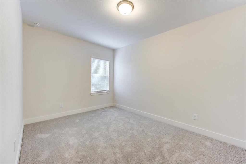Two well-sized secondary bedrooms feature large windows, ample closet space, and a neutral color scheme that complements any décor. These rooms are perfect for family, guests, or home office use.