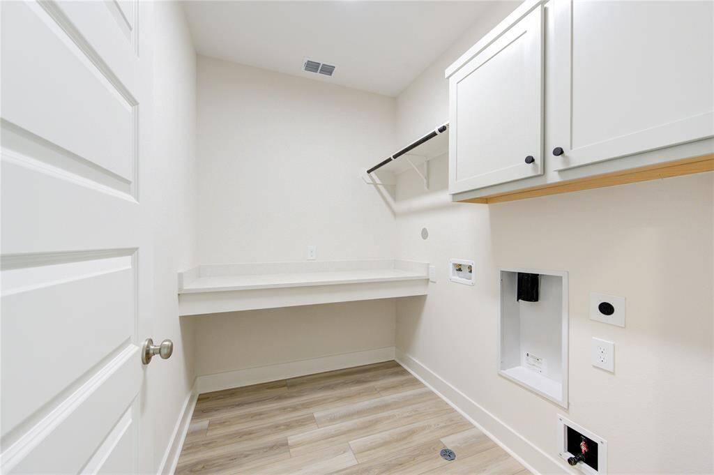 The spacious second-floor laundry room offers ultimate convenience and functionality. Located near the bedrooms, this well-designed space makes laundry day a breeze, eliminating the need to carry clothes up and down the stairs. Landlord will install new washer and dryer upon request.