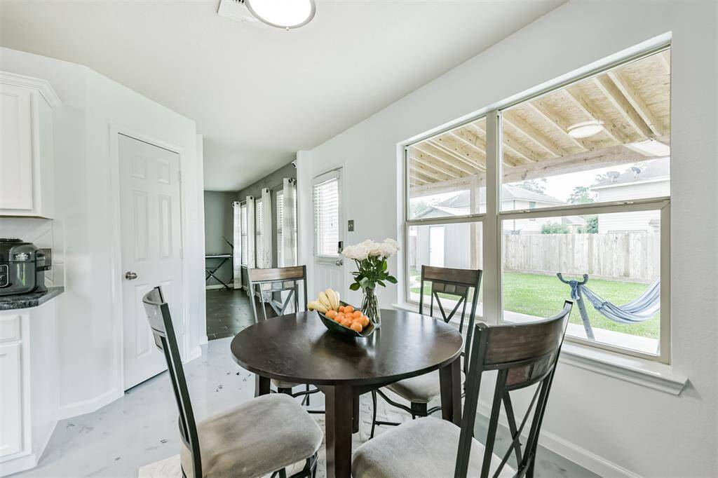 Enjoy peaceful backyard views while you dine, thanks to large windows that fill the breakfast area with natural light. With a covered patio just outside, indoor-outdoor living has never felt so relaxed.