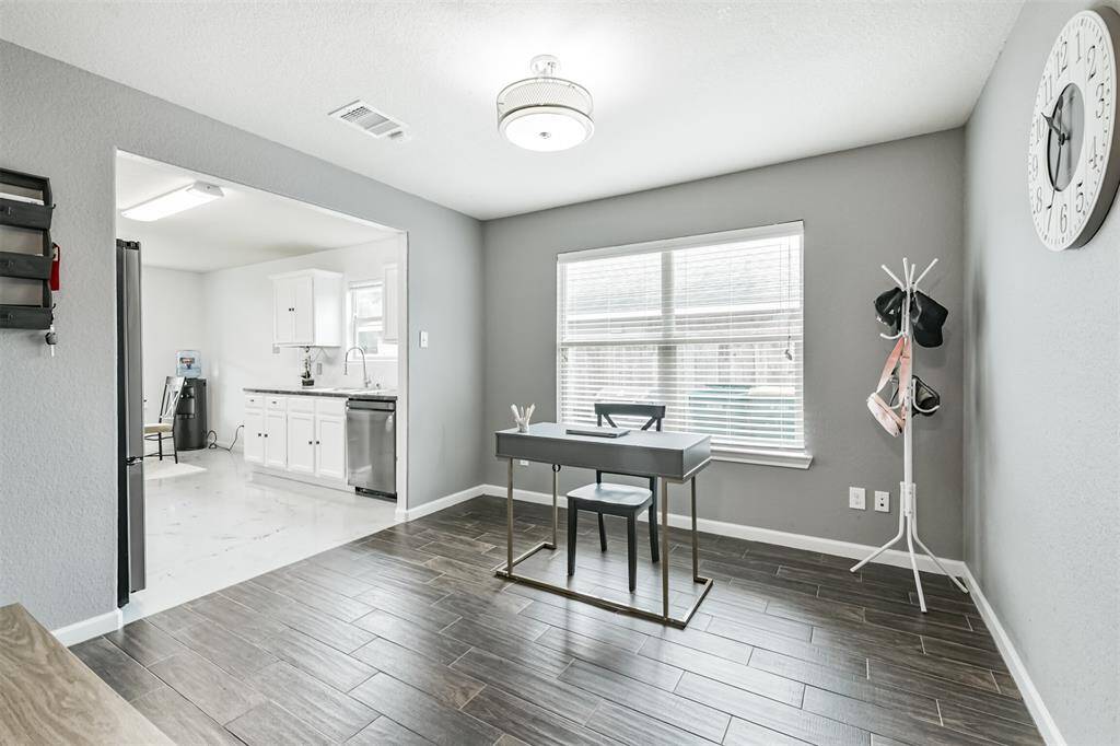 This flexible space connects effortlessly to the kitchen, making it ideal as a formal dining room, homework hub, or home office. The large window brings in soft, natural light, making the room feel open and welcoming no matter how you choose to use it.