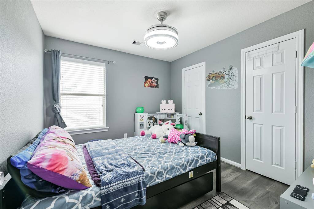 This third bedroom offers a cozy and cheerful space with room to grow—perfect for a child’s room, nursery, or guest space. With a large window, closet, and neutral finishes, it’s easy to make this room your own