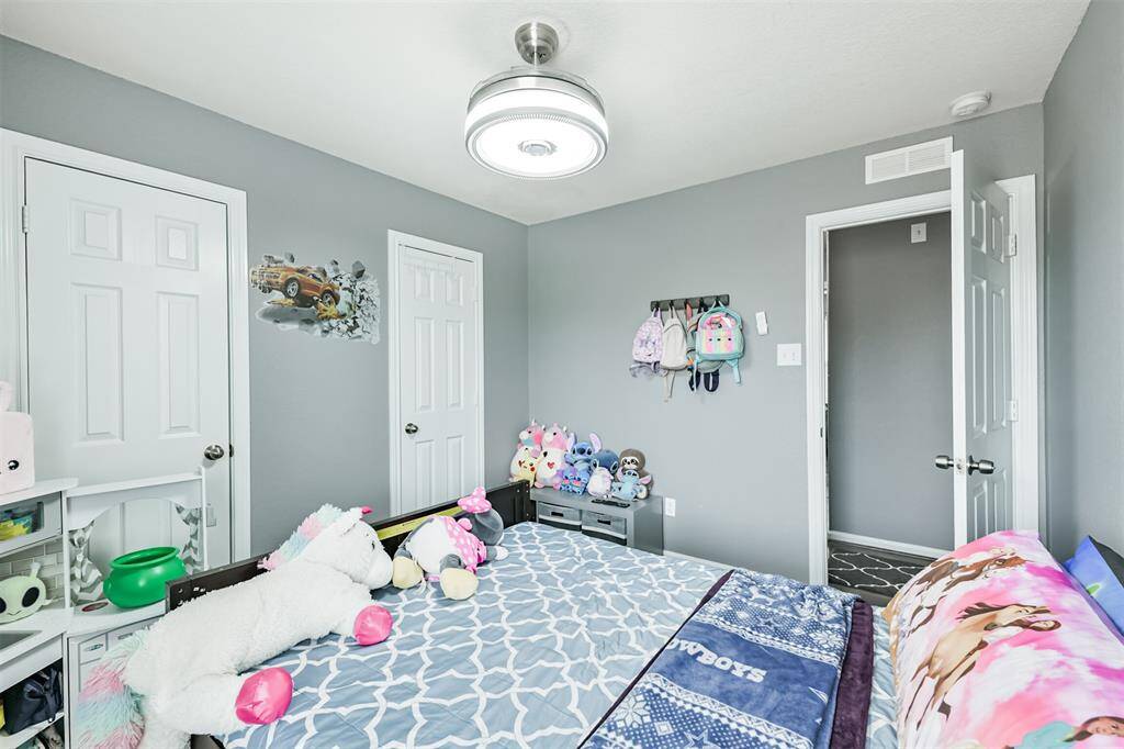 This additional angle showcases the thoughtful layout of the third bedroom, featuring easy access to storage and hallway spaces. Bright, neutral tones and modern finishes make it move-in ready for any purpose.