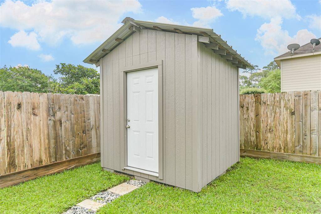This standalone storage shed adds valuable space for tools, lawn equipment, or seasonal décor—keeping your garage and home clutter-free while everything stays within easy reach.