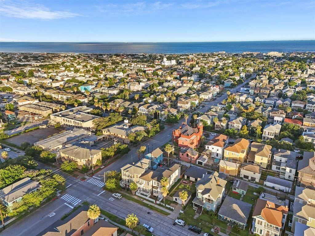 Sweeping aerial perspective with views of both the Gulf and Galveston’s historic neighborhood charm.