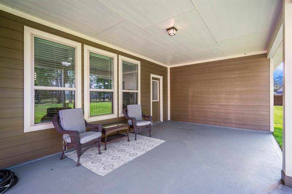 From the back porch, we get a view towards the back door, offering a seamless transition from indoor to outdoor living.