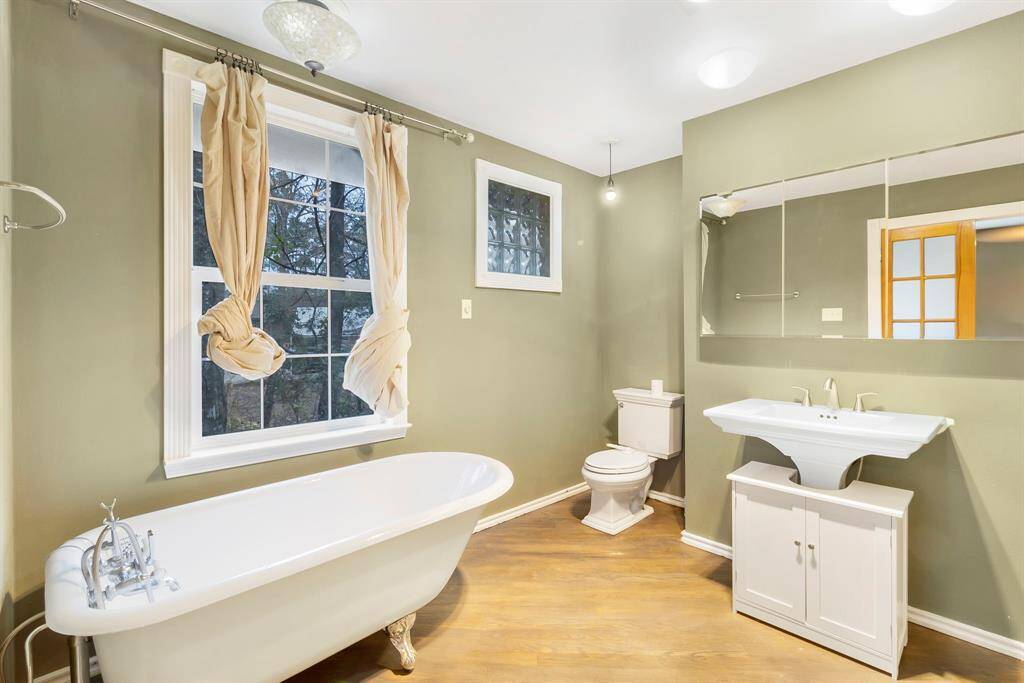 Primary bathroom features a beautiful clawfoot tub!