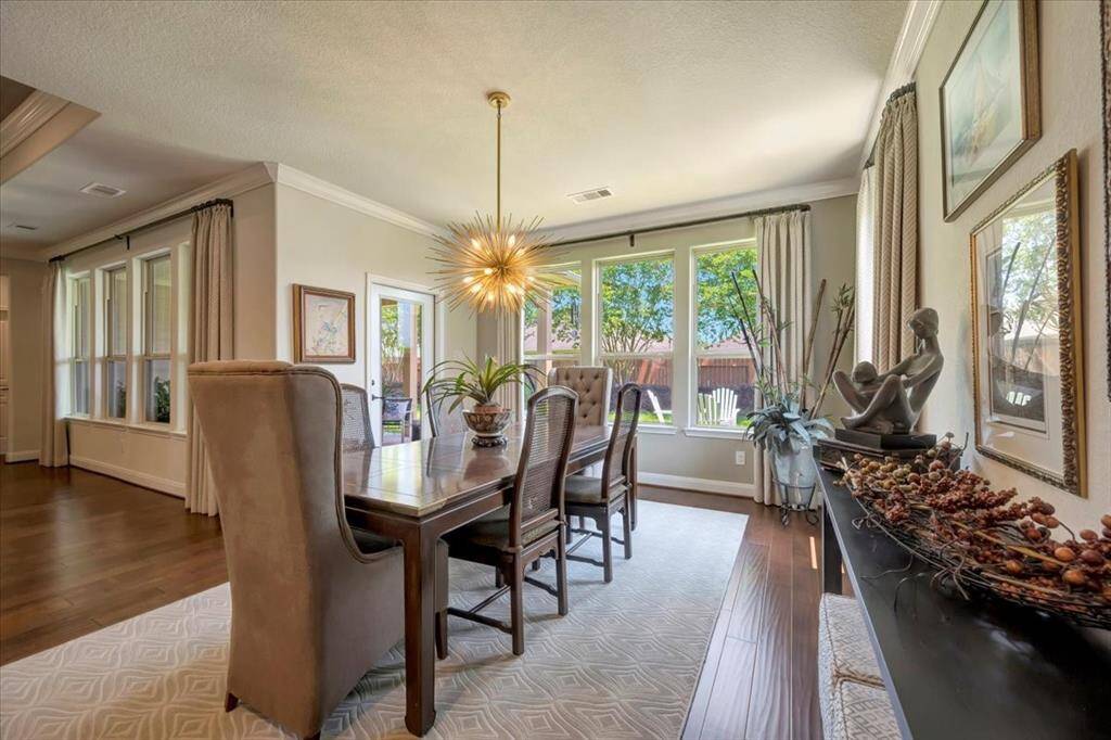 Another view of the dining area with beautiful views of the backyard.
