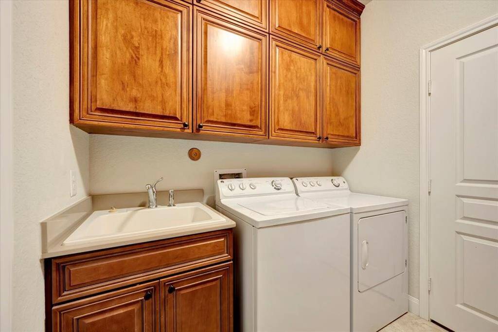 The laundry features the "much desired sink" and custom built in storage.