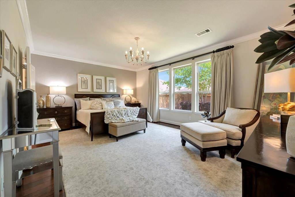 Does a designer live here? You'll fall in love with this exquisite primary bedroom!