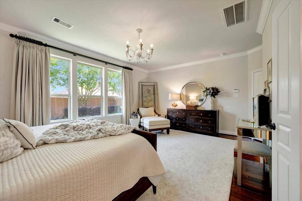 Elegance is found throughout the home but the primary bedroom is truly an opulent and visually captivating sanctuary!