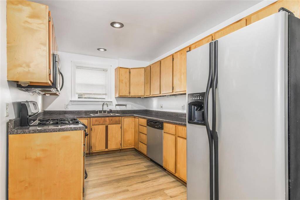 Modern kitchen on the main level of the duplex, featuring sleek appliances and ample cabinet space.