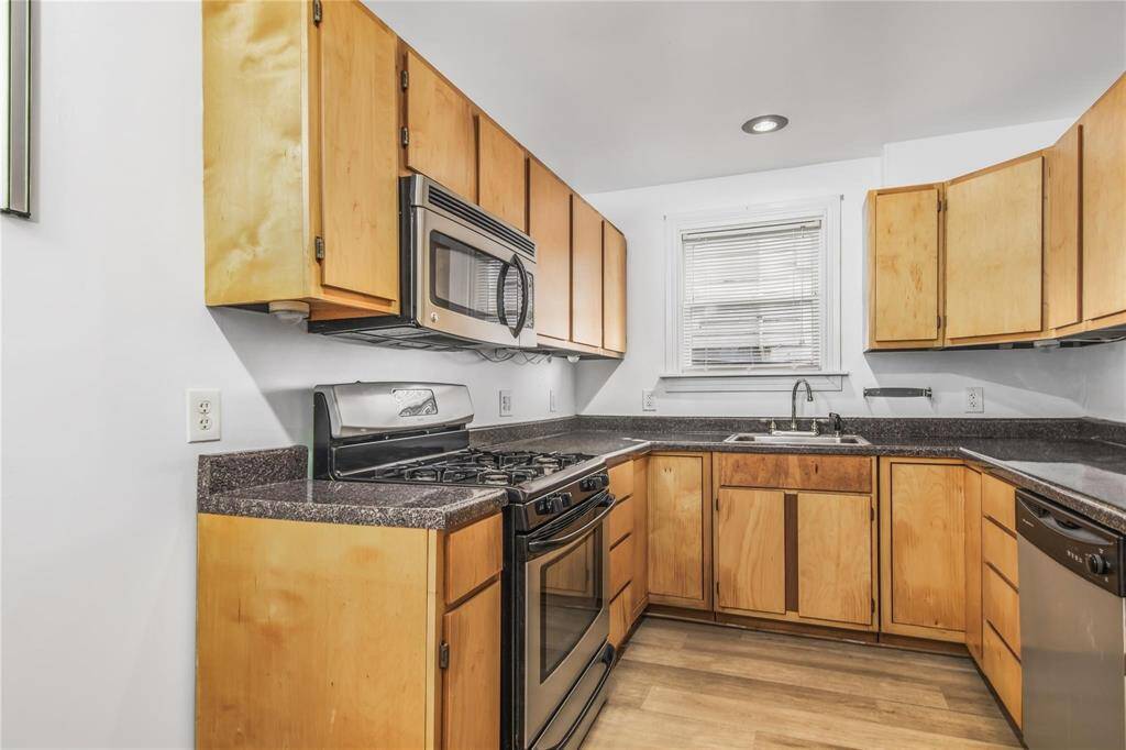 Modern kitchen on the first level of this duplex, featuring sleek appliances and ample counter space.