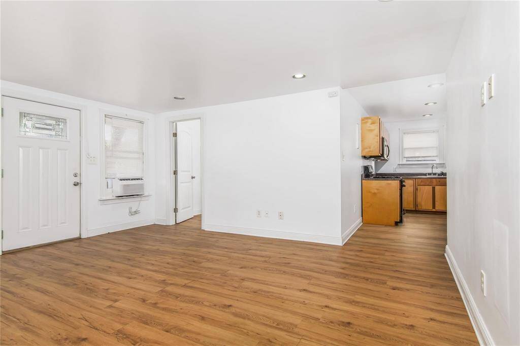 Bright and inviting open-concept family room and kitchen with modern finishes and ample natural light.